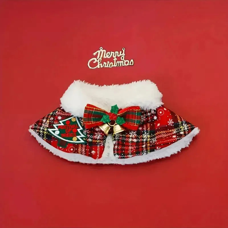Red festive dog scarf with bell pattern fastened around a small dog's neck in winter.