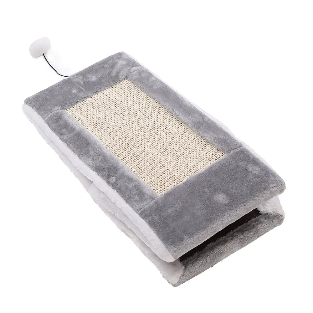 Grey and white triangle cat scratching post with integrated plush bed for cats.