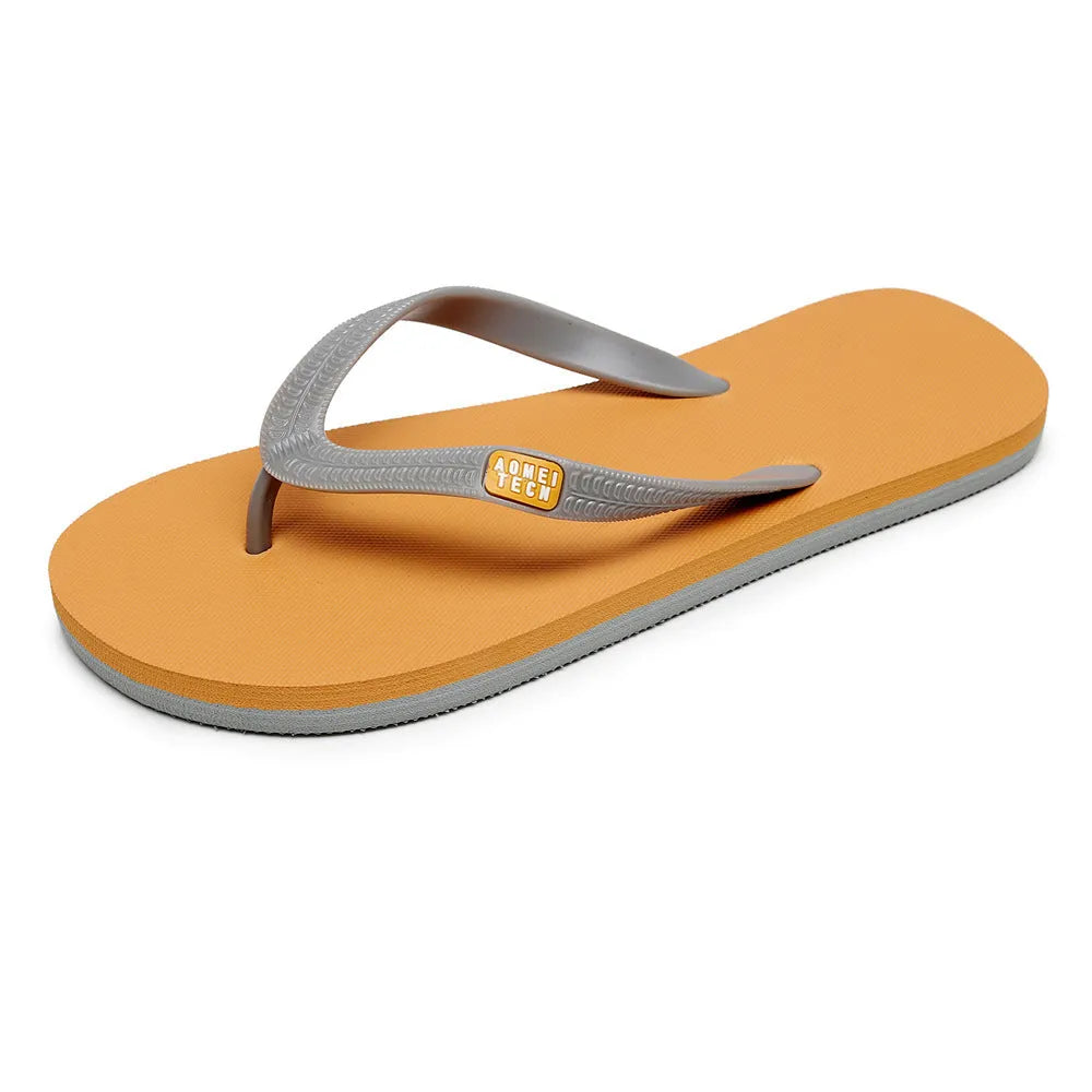 Men's black flip-flops with a textured rubber sole and a lightweight EVA upper on a sandy beach.