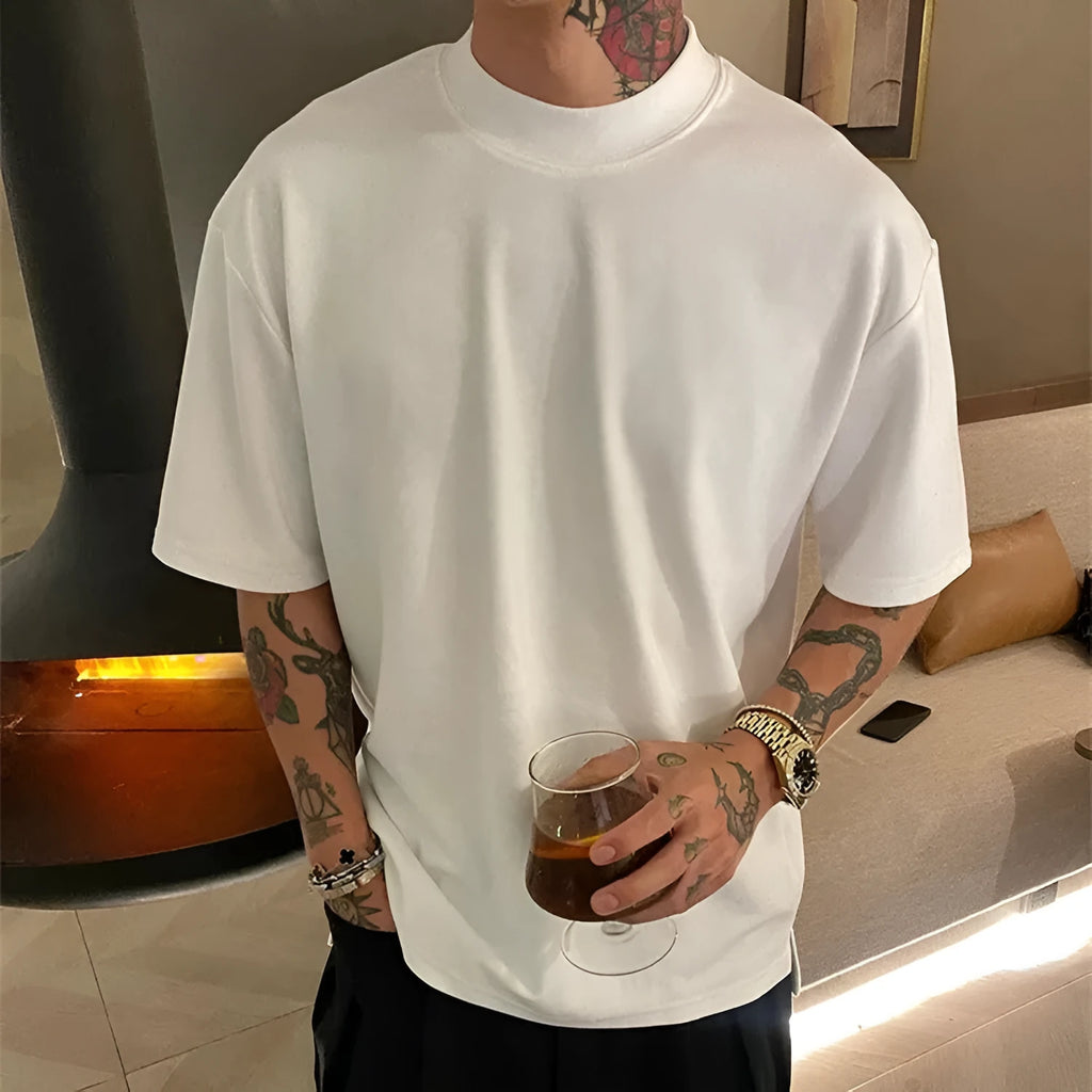 Man wearing a loose-fitting apricot-coloured pure cotton casual half-sleeve pullover shirt.
