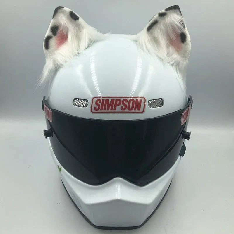 Set of black and white wolf ear and tail ornaments clipped to a motorcycle helmet