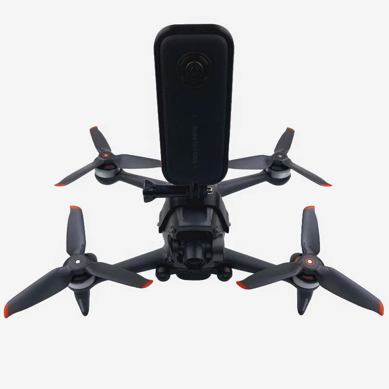 3D printed hard plastic FPV drone top expansion bracket with grey sponge padding for GoPro cameras.