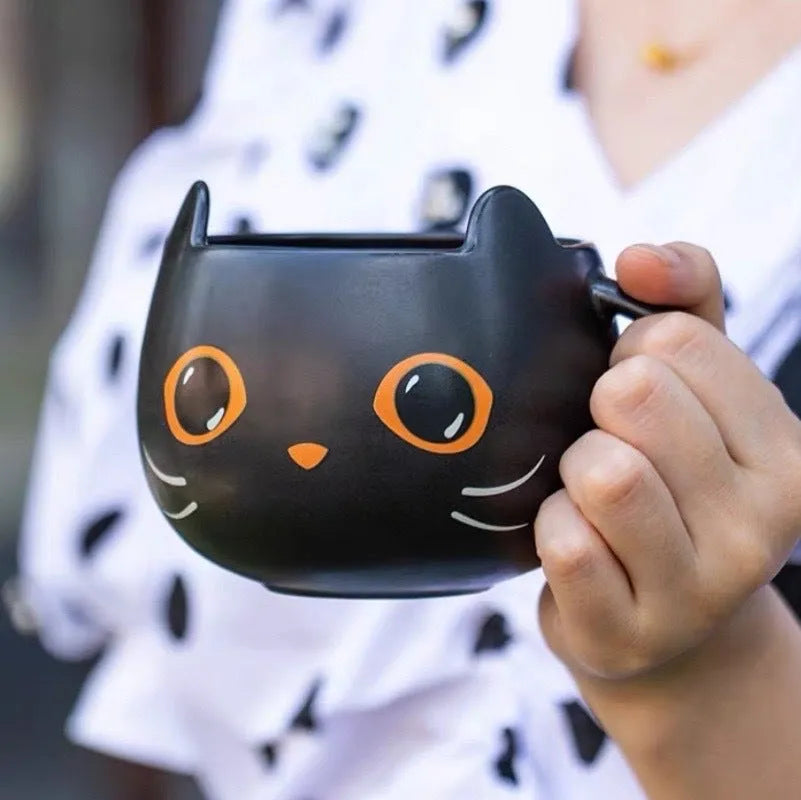 Black ceramic cat-shaped mug with pumpkin decoration and optional spoon lid, 355ml capacity.