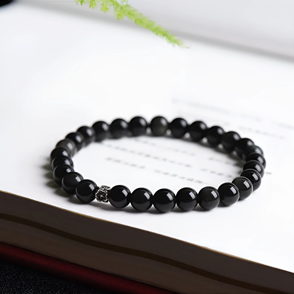Natural obsidian bracelet with S925 silver flower accessories showing 6mm stone beads