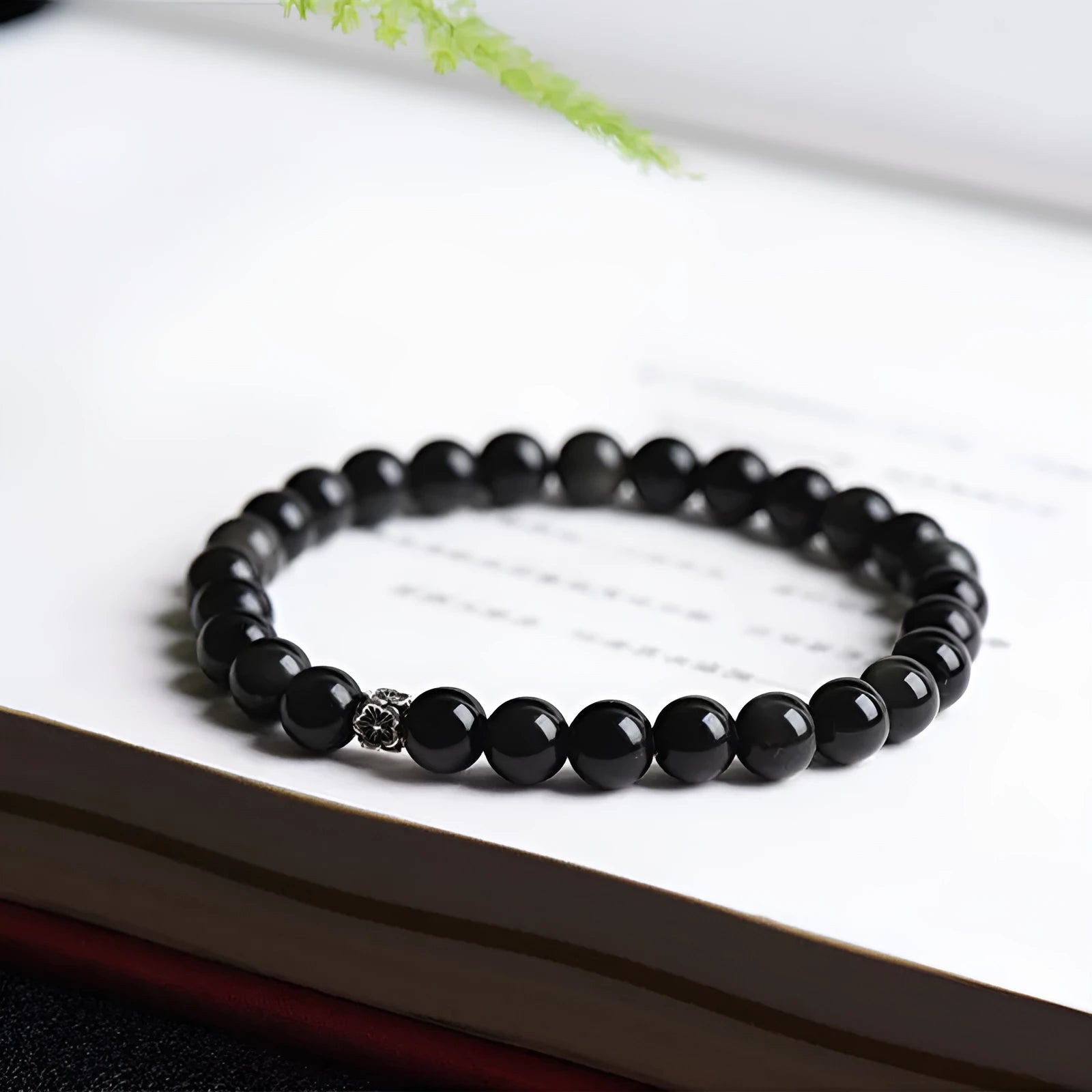 Natural obsidian bracelet with S925 silver flower accessories showing 6mm stone beads