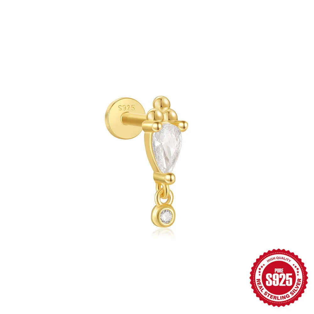 S925 sterling silver ear stud with XINGX inlaid tassel design in a gold colour.