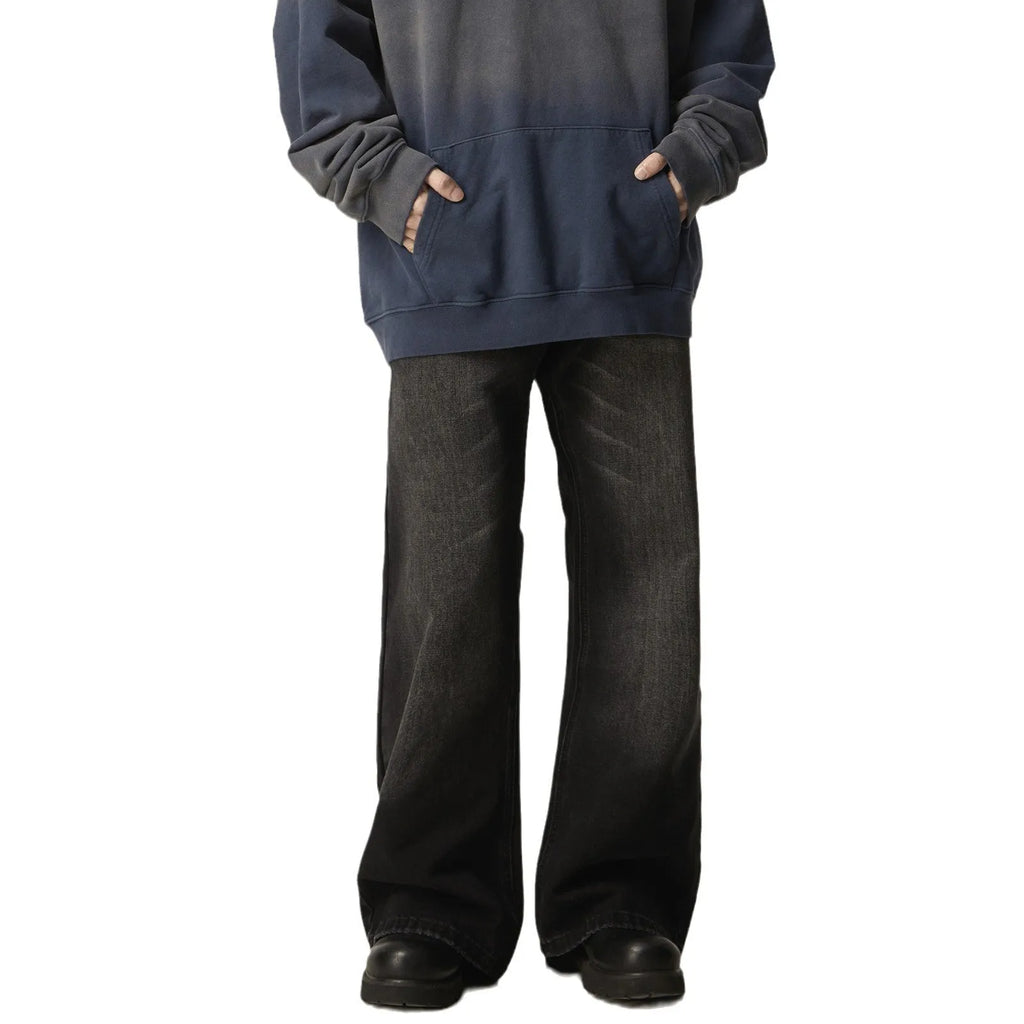 Black American retro loose straight jeans with zip fly opening on denim background