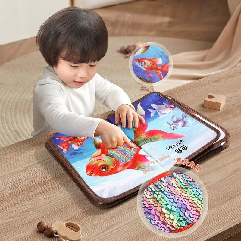 Infant touching textured page of animal sound book with colourful illustrations and button