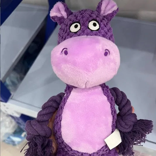 Plush dog toy with rope and squeaker in hippo design for tug-of-war play.