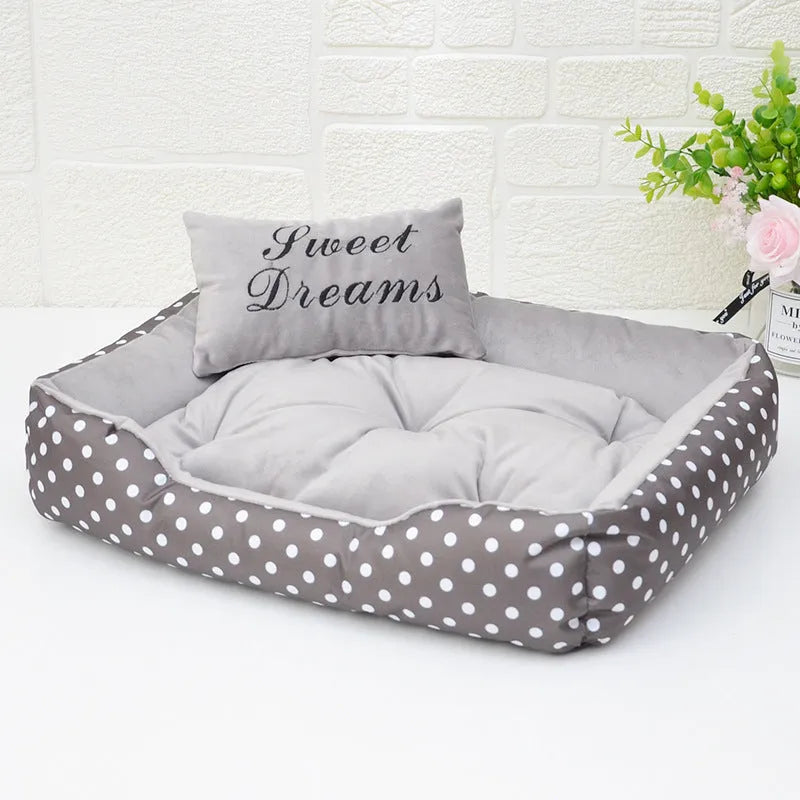 Polka dot print cloth dog bed with matching square pillow for small dogs, shown in grey colour.