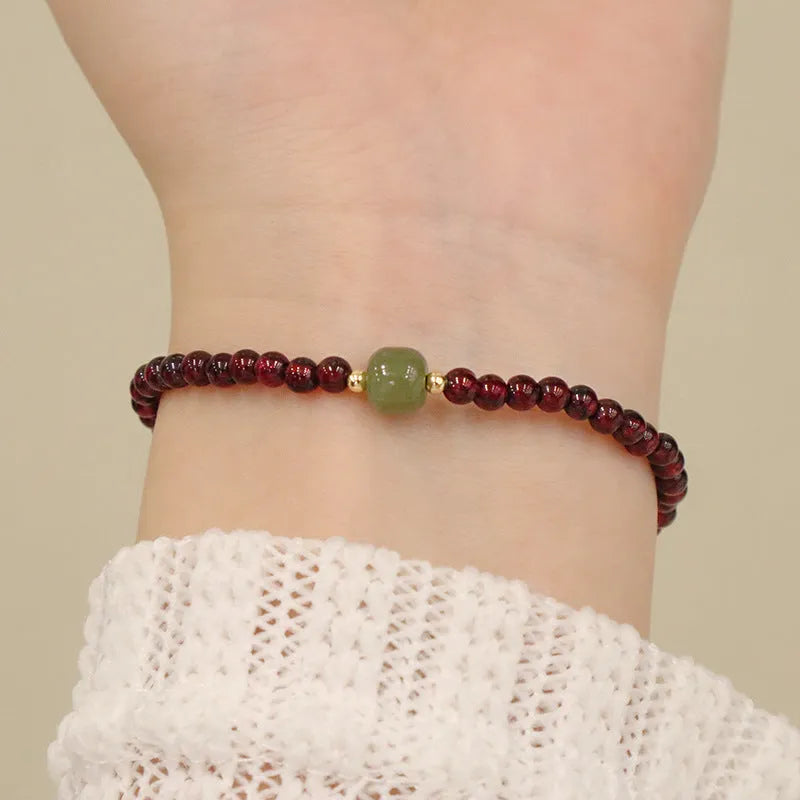 Chinese-style gourd bracelet with imitation garnet beads and Fu character symbols on U-shaped electroplated setting