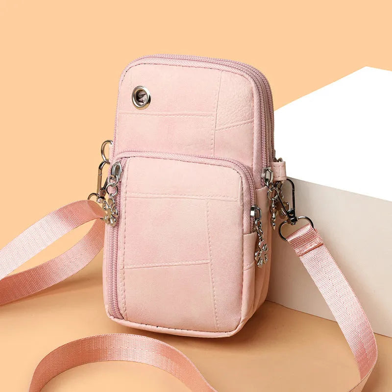 Vertical square mini phone bag in four colour options with sandwich pocket design