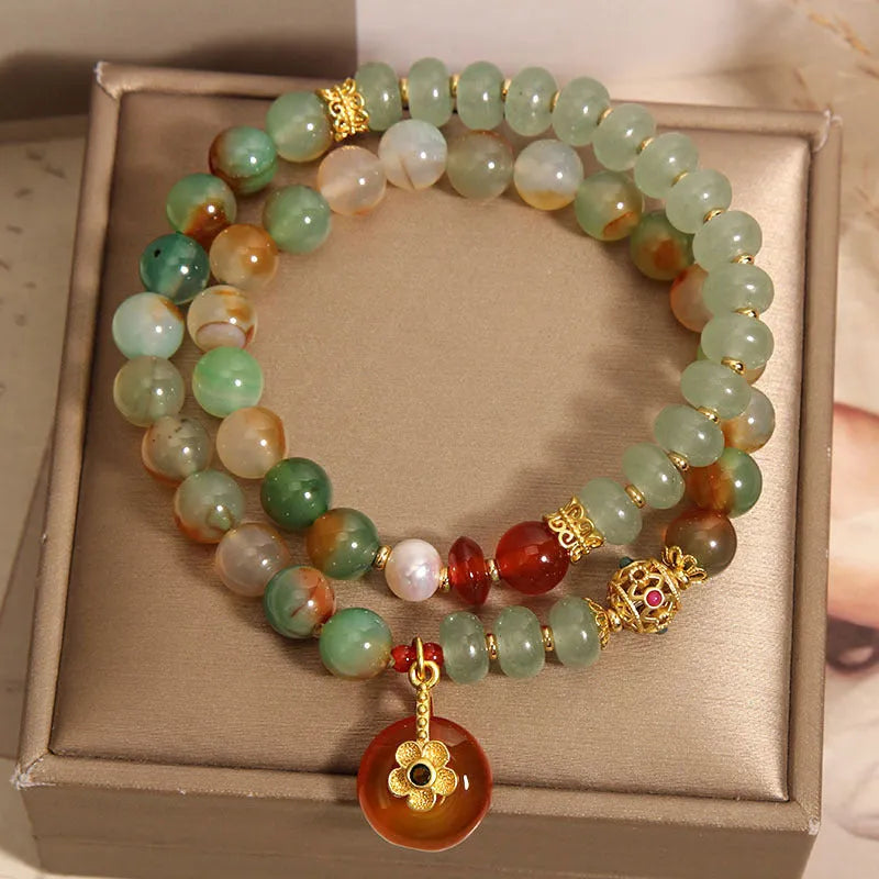 Women's peacock green agate double ring bracelet with safety buckle closure and rhinestone accents