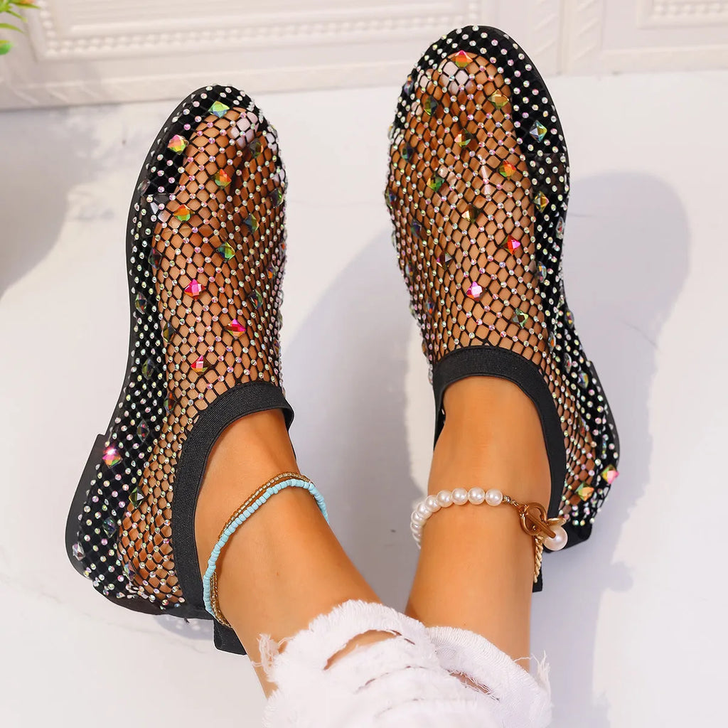 Women's flat mesh sandals with colourful rhinestone detail on a white background.