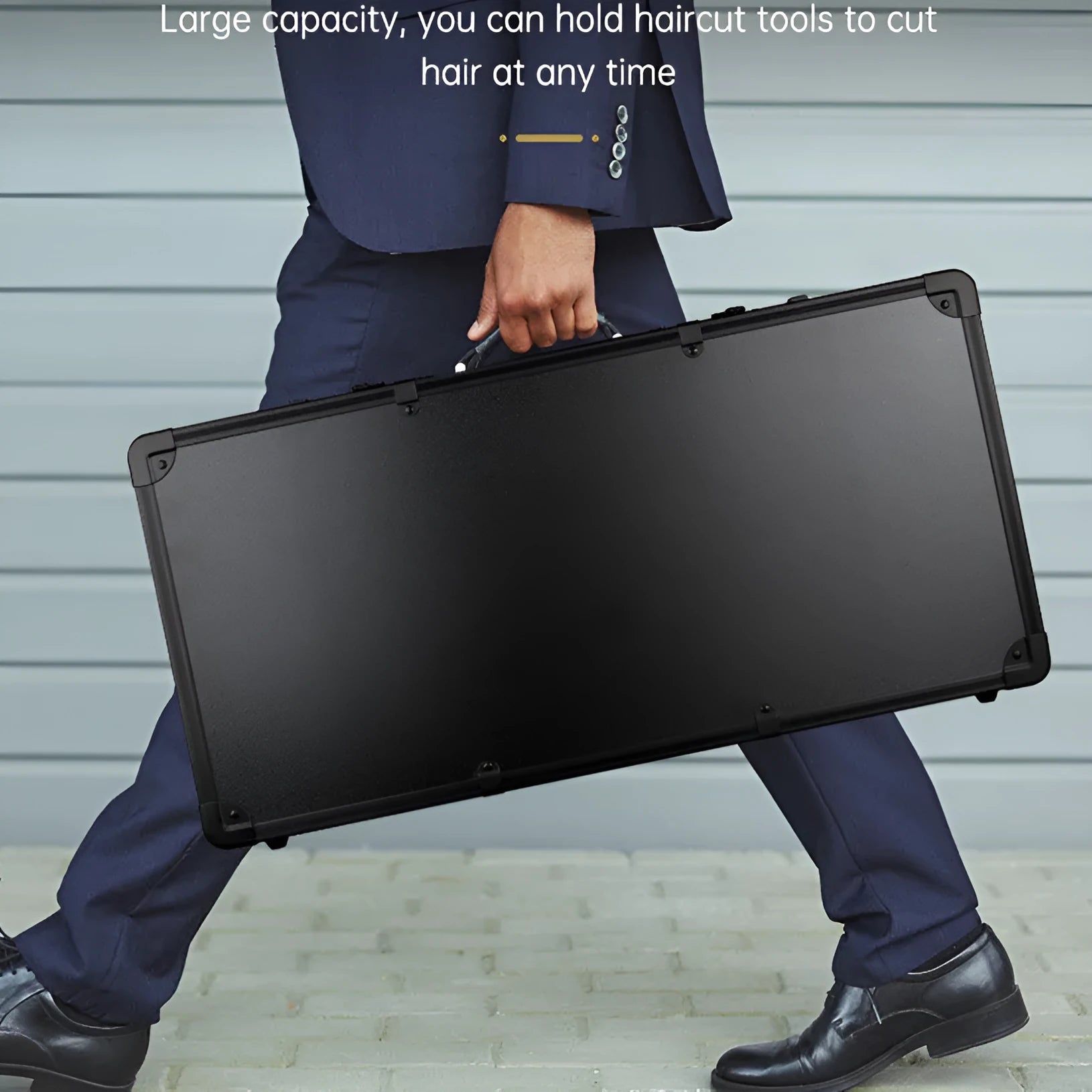Black PVC suitcase with combination lock for storing hair styling tools, shown with dimensions 55cm by 27cm.