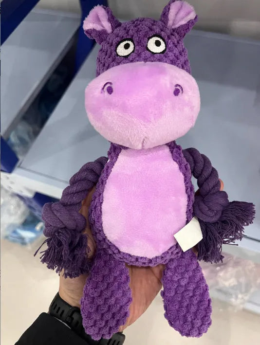 Plush dog toy with rope and squeaker in hippo design for tug-of-war play.