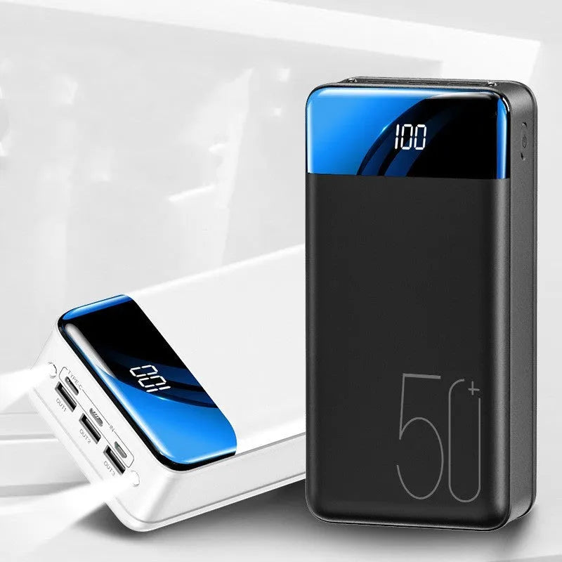 Black and white 50000mAh power bank showing three USB output ports and its large form factor.
