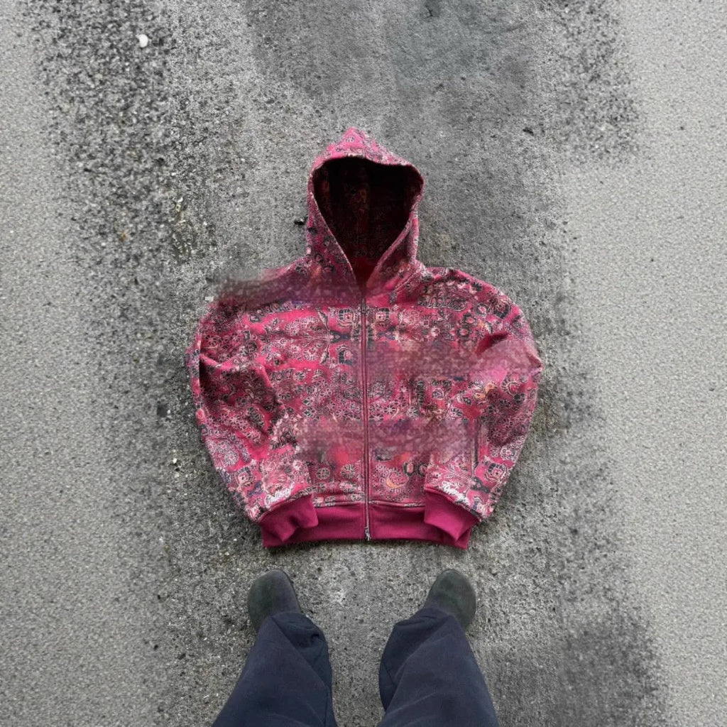 Man wearing a loose-fitting blue hooded zip coat with long sleeves for casual autumn wear.
