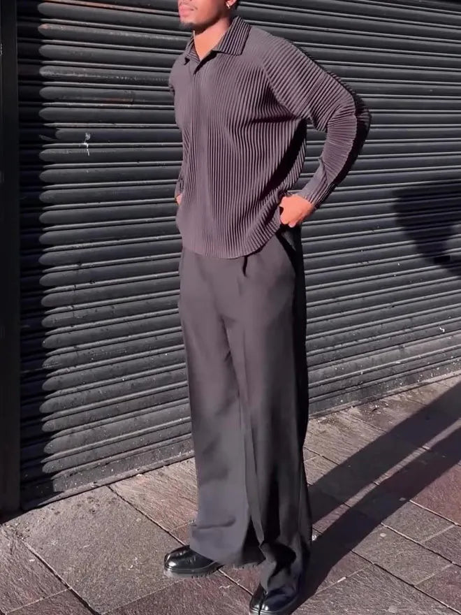 Black men's pleated long-sleeved casual top made from polyester fabric.