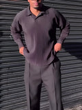 Black men's pleated long-sleeved casual top made from polyester fabric.