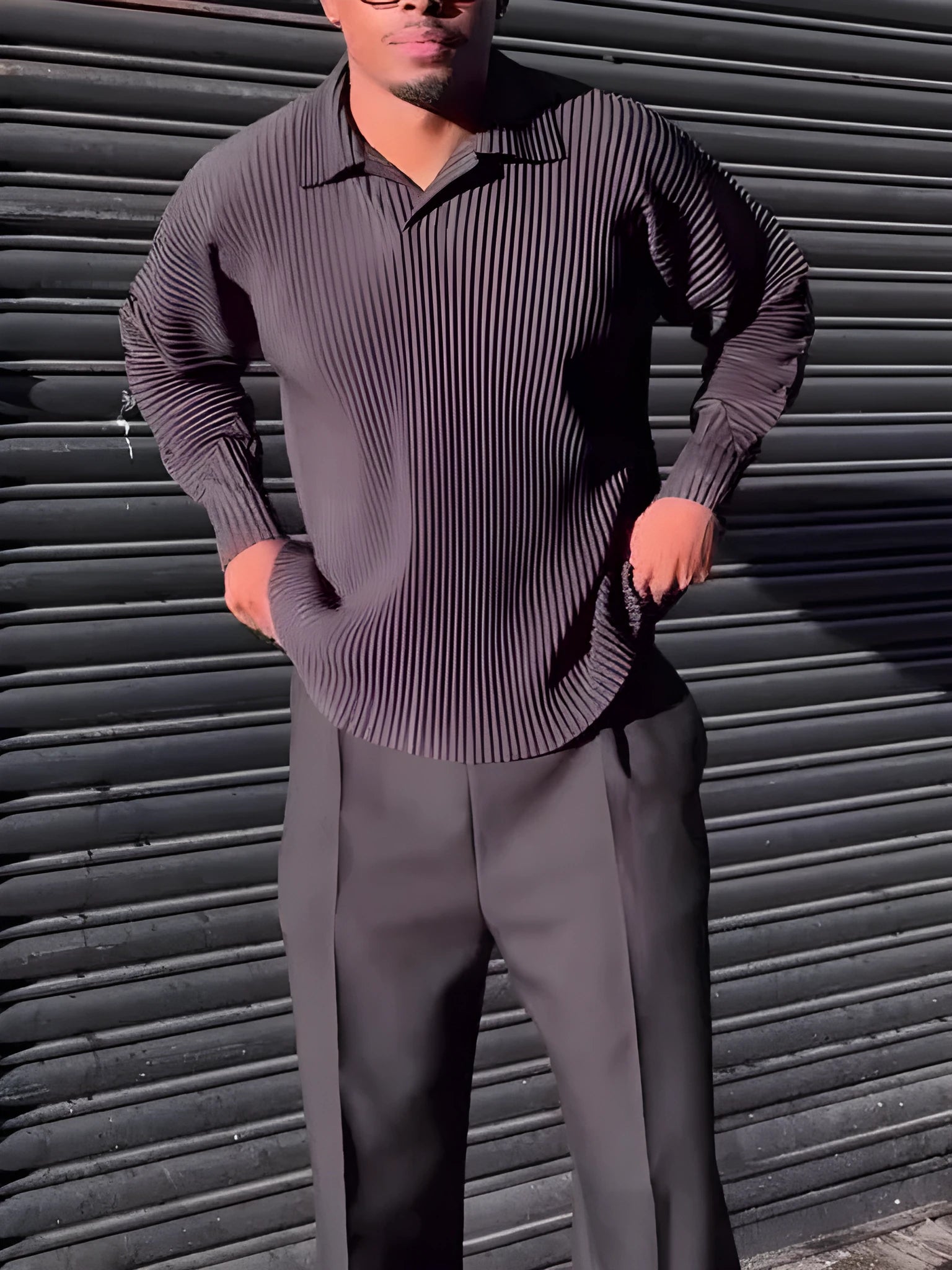 Black men's pleated long-sleeved casual top made from polyester fabric.