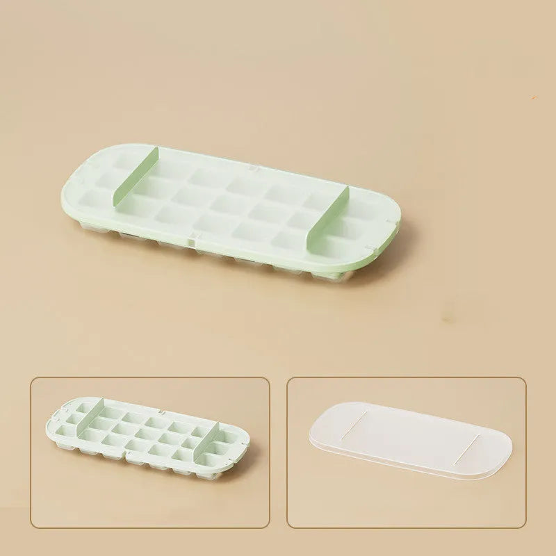 A high-capacity blue ice cube tray with a leverage-action lid and a stored ice shovel.