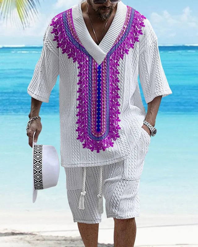 Man wearing a printed drop-shoulder knitted short-sleeve top with matching shorts.