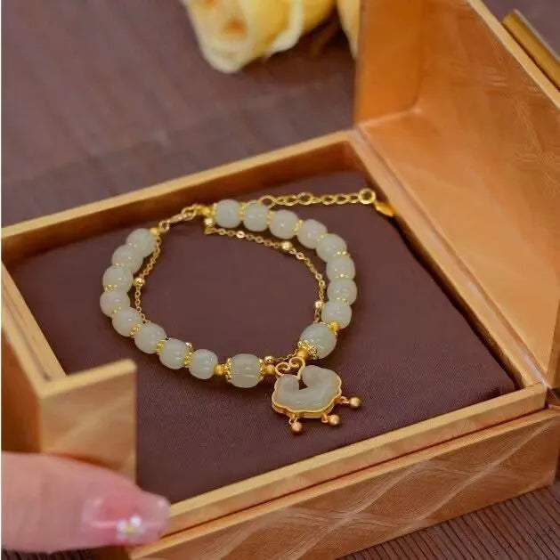 Women's green safety lock bell pendant bracelet with Xiangyun lock design on wrist