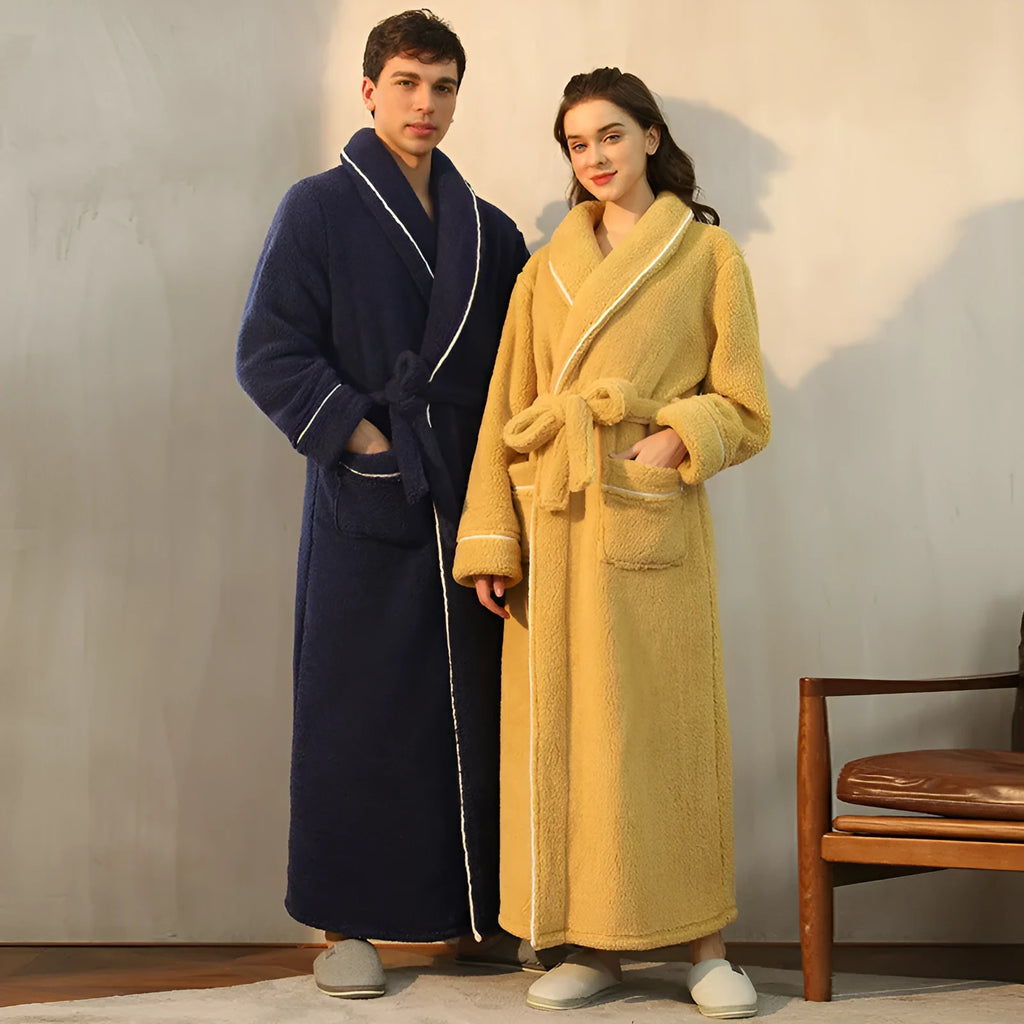 A man and woman wearing matching heavyweight navy blue flannel bathrobes, a couple's winter nightgown set.