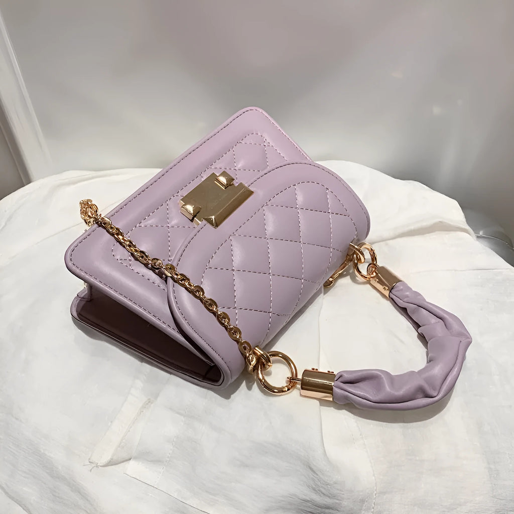 Purple Korean-style ladies square crossbody bag with soft PU texture on a table.