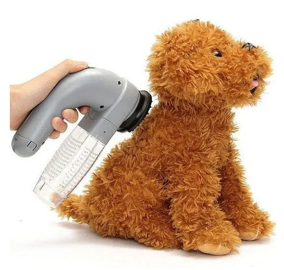 Grey handheld pet hair vacuum cleaner with soft rubber grooming brush head