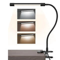 Black and white USB-powered LED desk lamp with a 26 cm length on a desk.