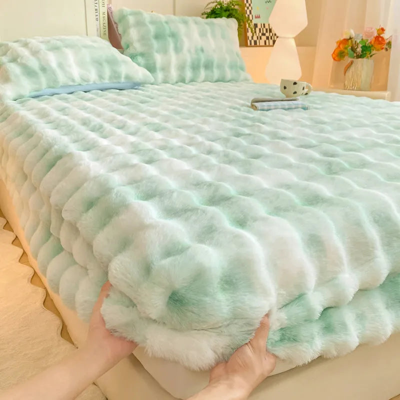 Class A milk fiber fitted sheet with rabbit plush in clear blue, showing elastic edges and smooth surface