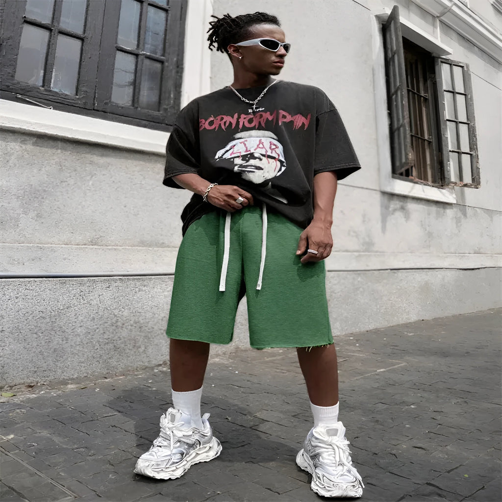 Men's black straight-leg hip-hop trousers in a medium length, laid flat.