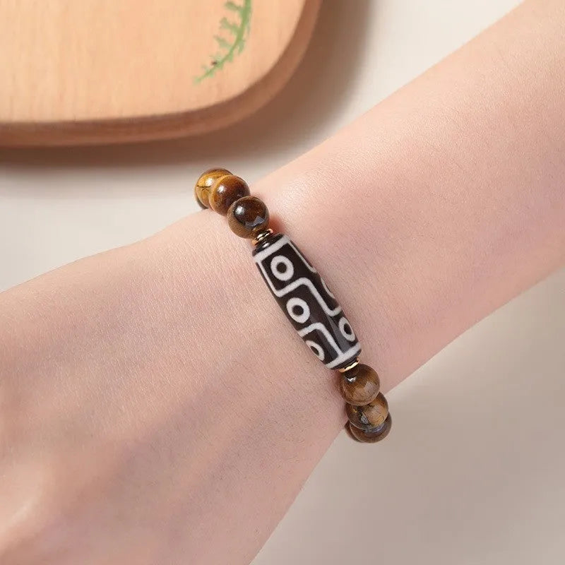 Simple single-circle Tigereye Dzi bead rosary bracelet showing the banded stone, available in multiple bead sizes.