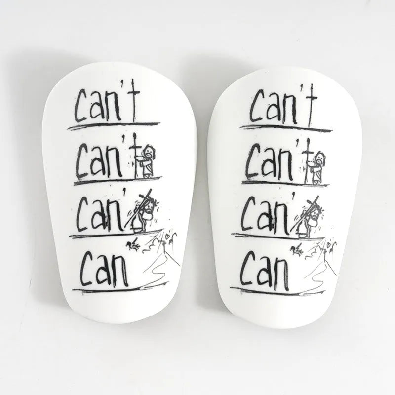 Football training shin guards in PU material showing black, blue, white, and white-black colour options