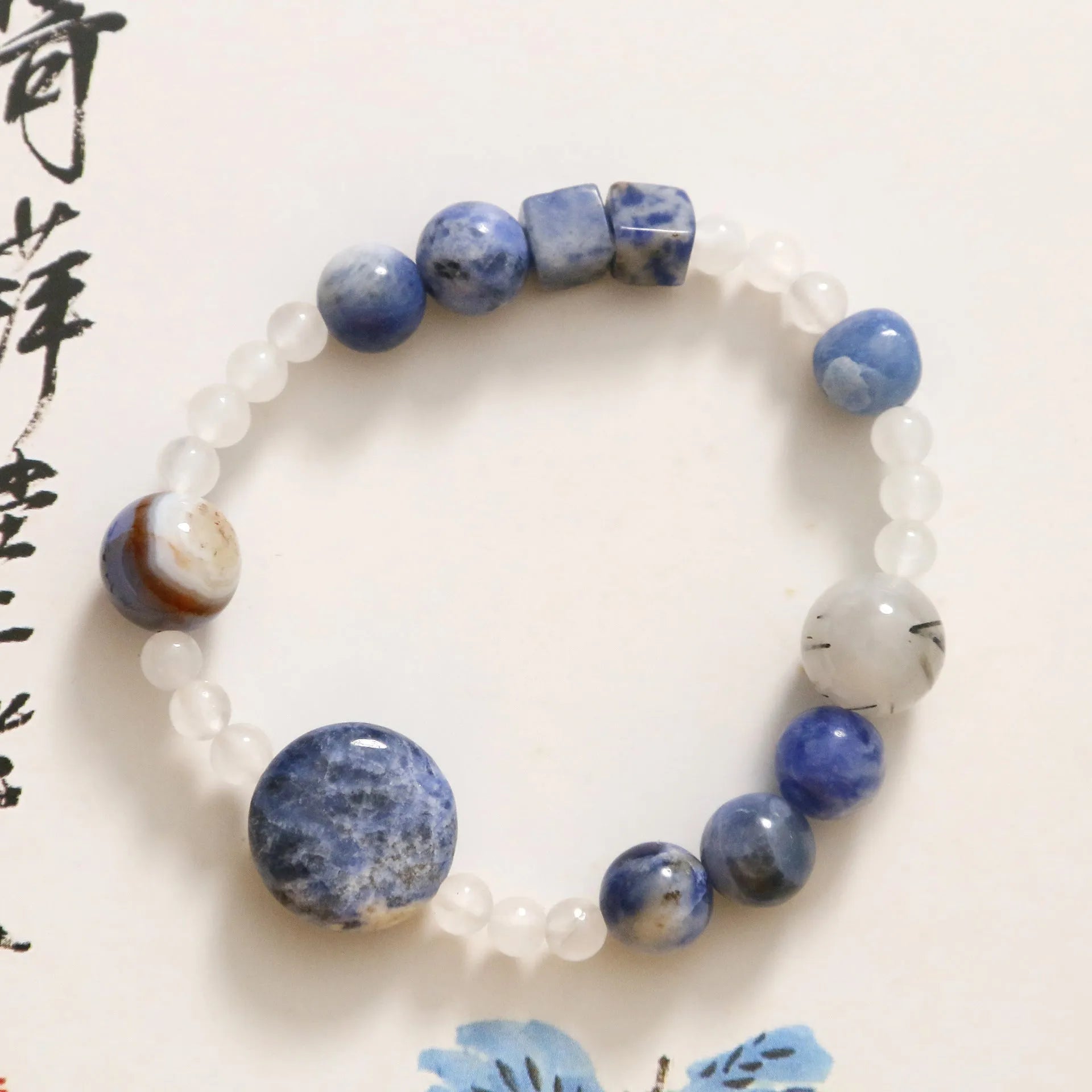 Hand-woven natural stone bracelet with blue point stone and black hair crystal agate beads