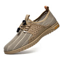 Men's breathable casual shoes in black with mesh upper, elastic band closure, and rubber sole