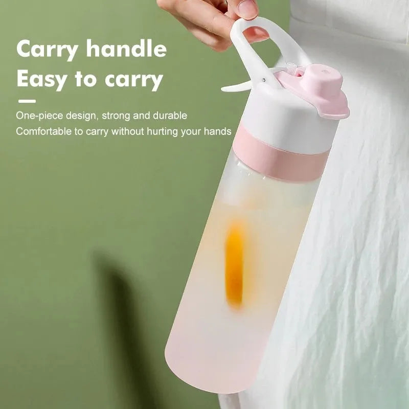 White 700ml plastic spray water bottle with handle strap and leakproof lid.