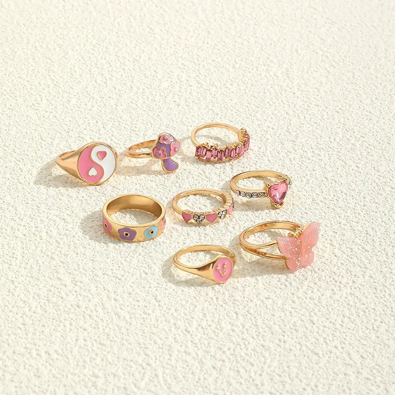 Set of 8 zinc alloy colour dripping rings with plant and flower motifs in European style