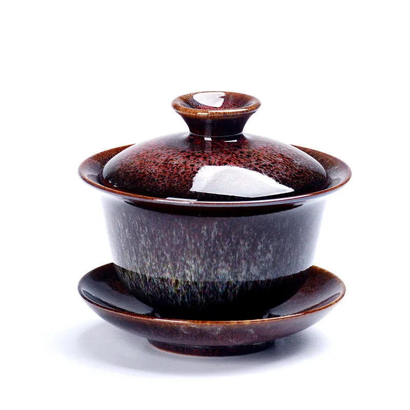 Three-piece ceramic tea set with covered bowl and teacup in black transmutation glaze finish