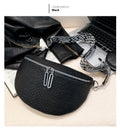 Women's PU leather crossbody bag with clamshell opening in solid colour with zipper texture details