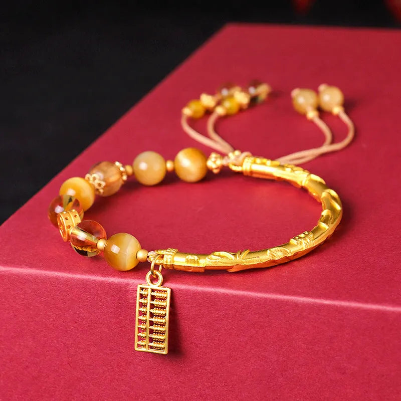 Tiger eye and citrine beaded bracelet with yellow crystal and diamond-shaped copper parts for women