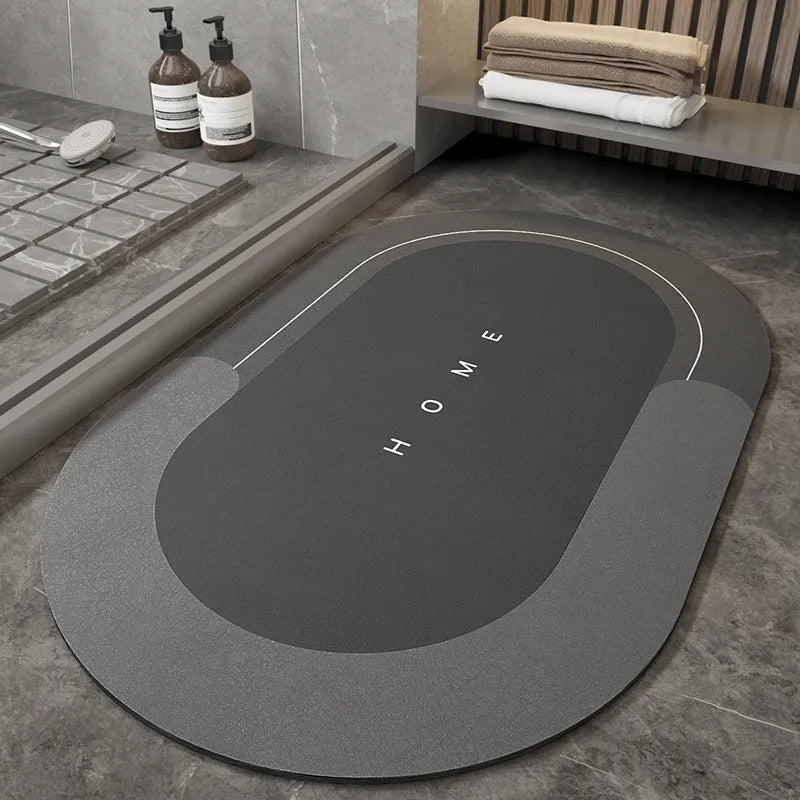 Machine-woven rectangular blue floor mat placed on a bathroom floor.