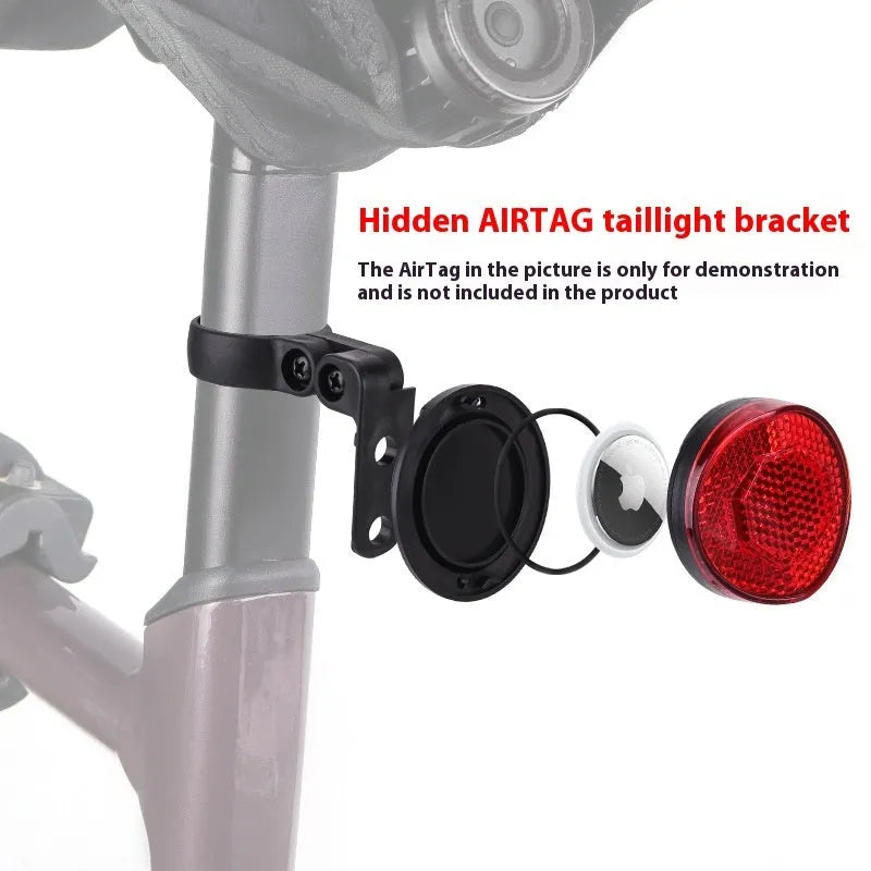 Red plastic anti-theft bicycle taillight bracket with integrated reflector mounted on a seat post.