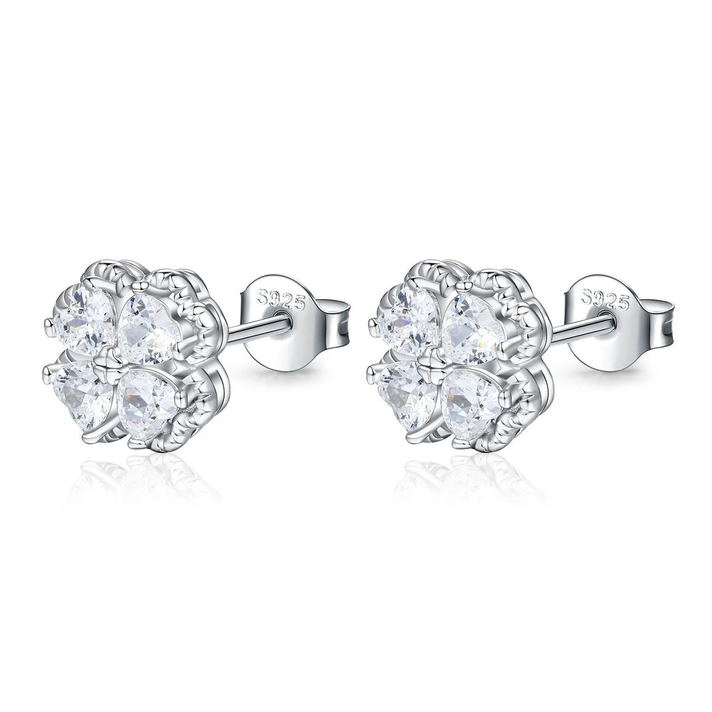 Close-up of women's heart-shaped zircon earrings in 925 silver with a white gold colour finish.