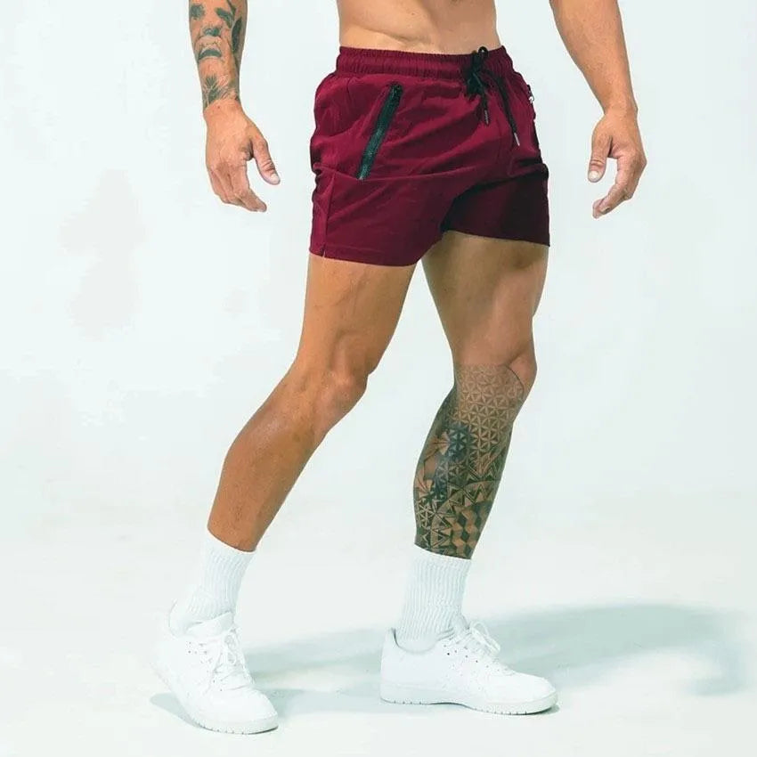 Men's blue casual sports shorts with a mid-waist fit, made from quick-drying polyester fabric.