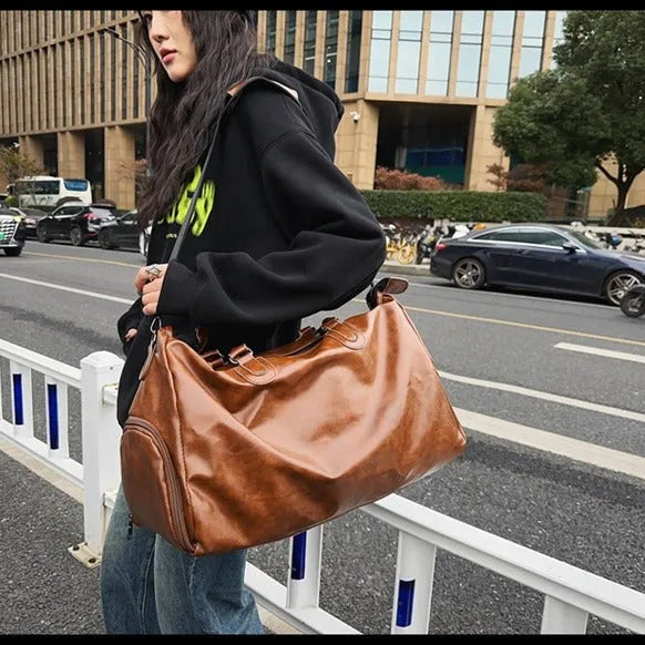 PU sporty minimalist crossbody backpack in black with single shoulder strap and 20-35L capacity