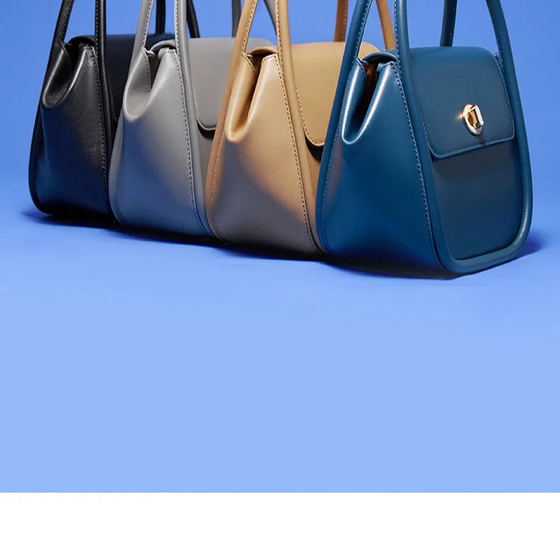 Women's leather wing tote bag in cow leather with buckle detail and cross-body strap