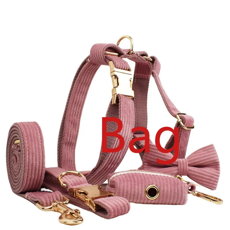 Red corduroy dog collar and leash set with matching vest, bow tie, and poo bag